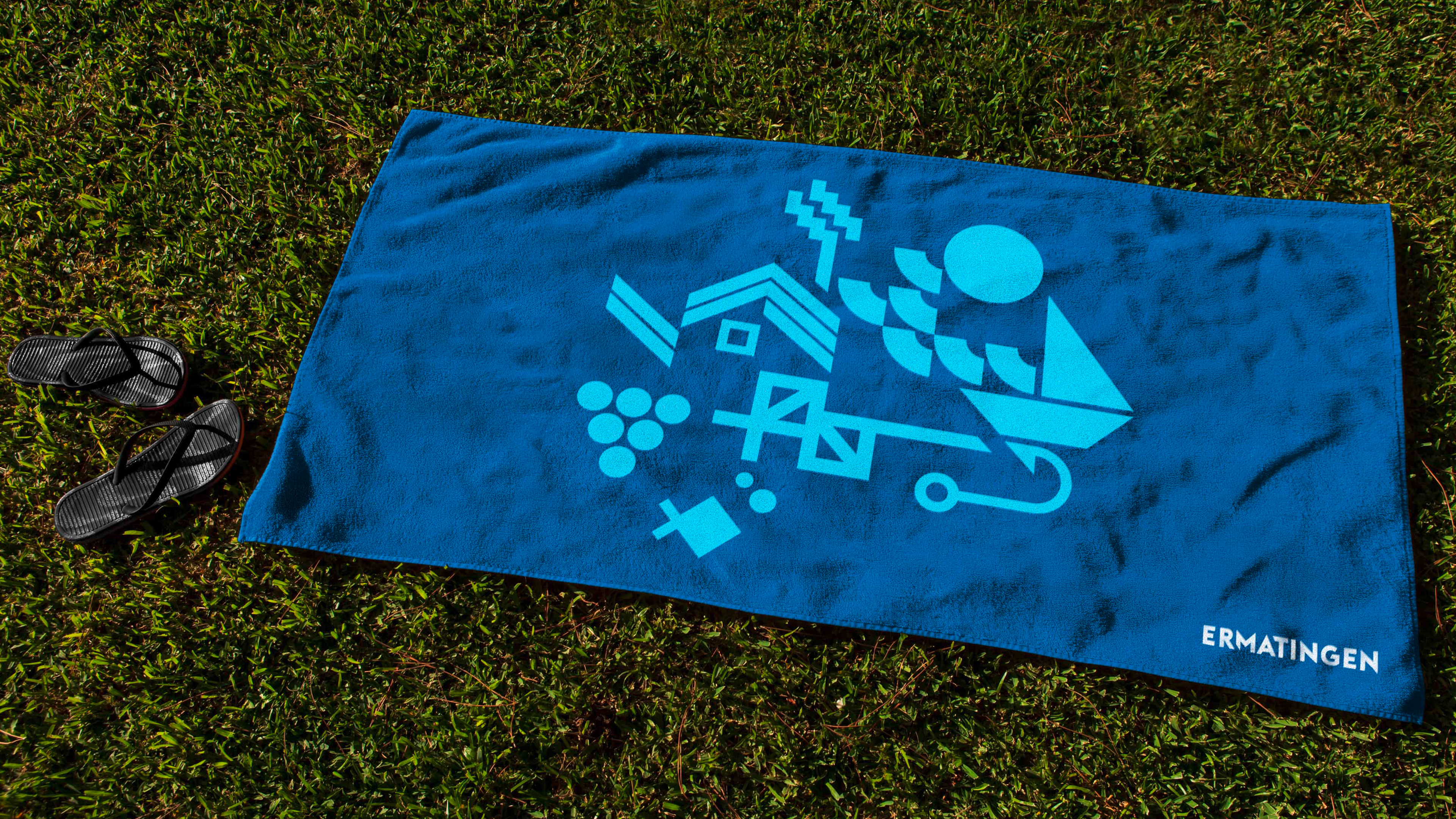 Aufbauende Animation für Ermatingen mit grafischen Elementen wie Haus, Boot, Sonne und Wasserwellen.